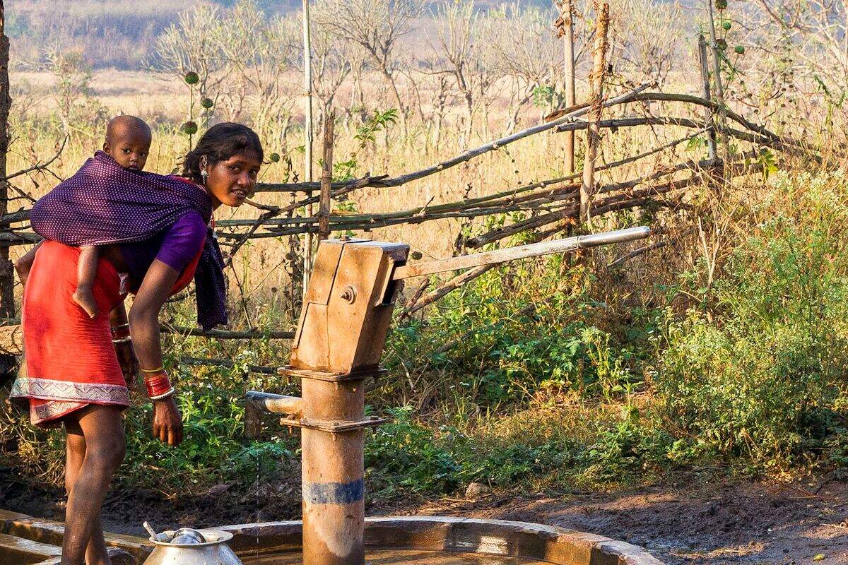 A village hand pump drawing clean water