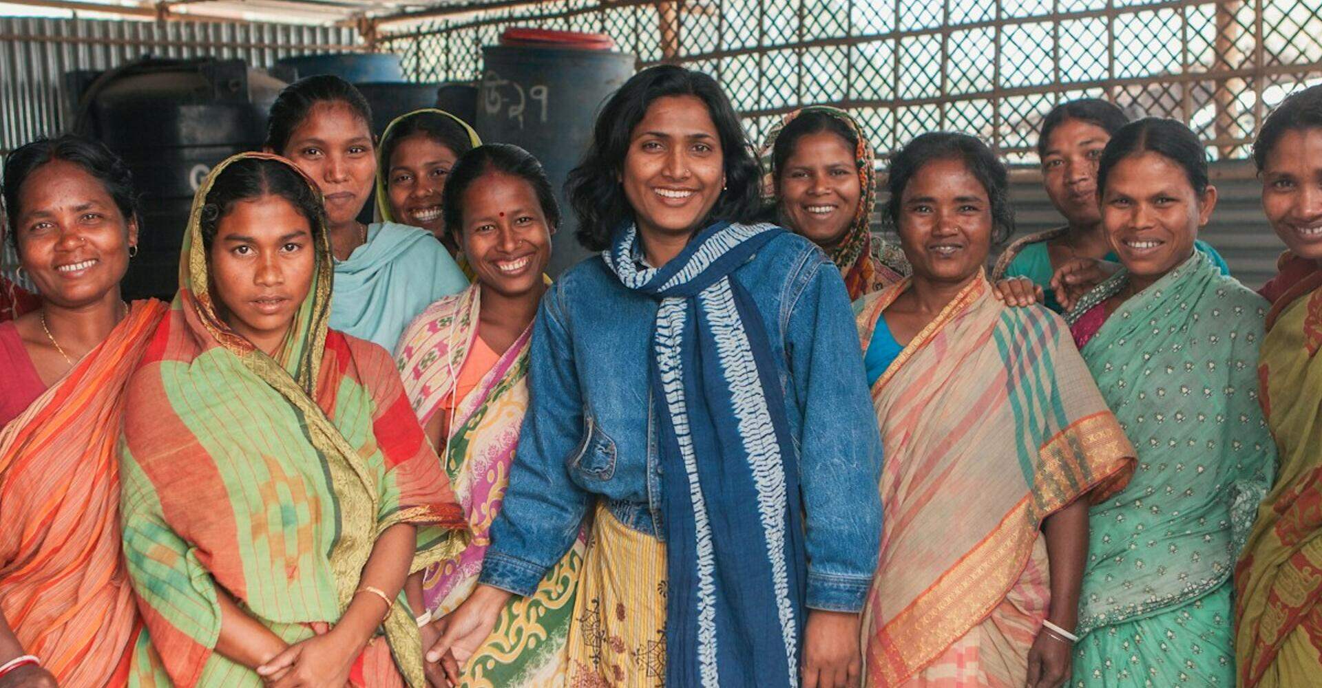 A large group of women of a village standing together